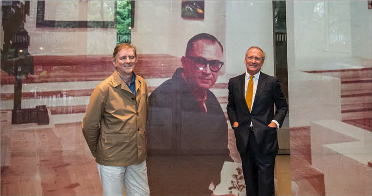 Exhibition designer Pedro Feduchi and Manuel Fontán del Junco of Fundación Juan March; behind them is a photograph of Fernando Zóbel at the Museo de Arte Abstracto Español, which he founded in Cuenca, Spain.