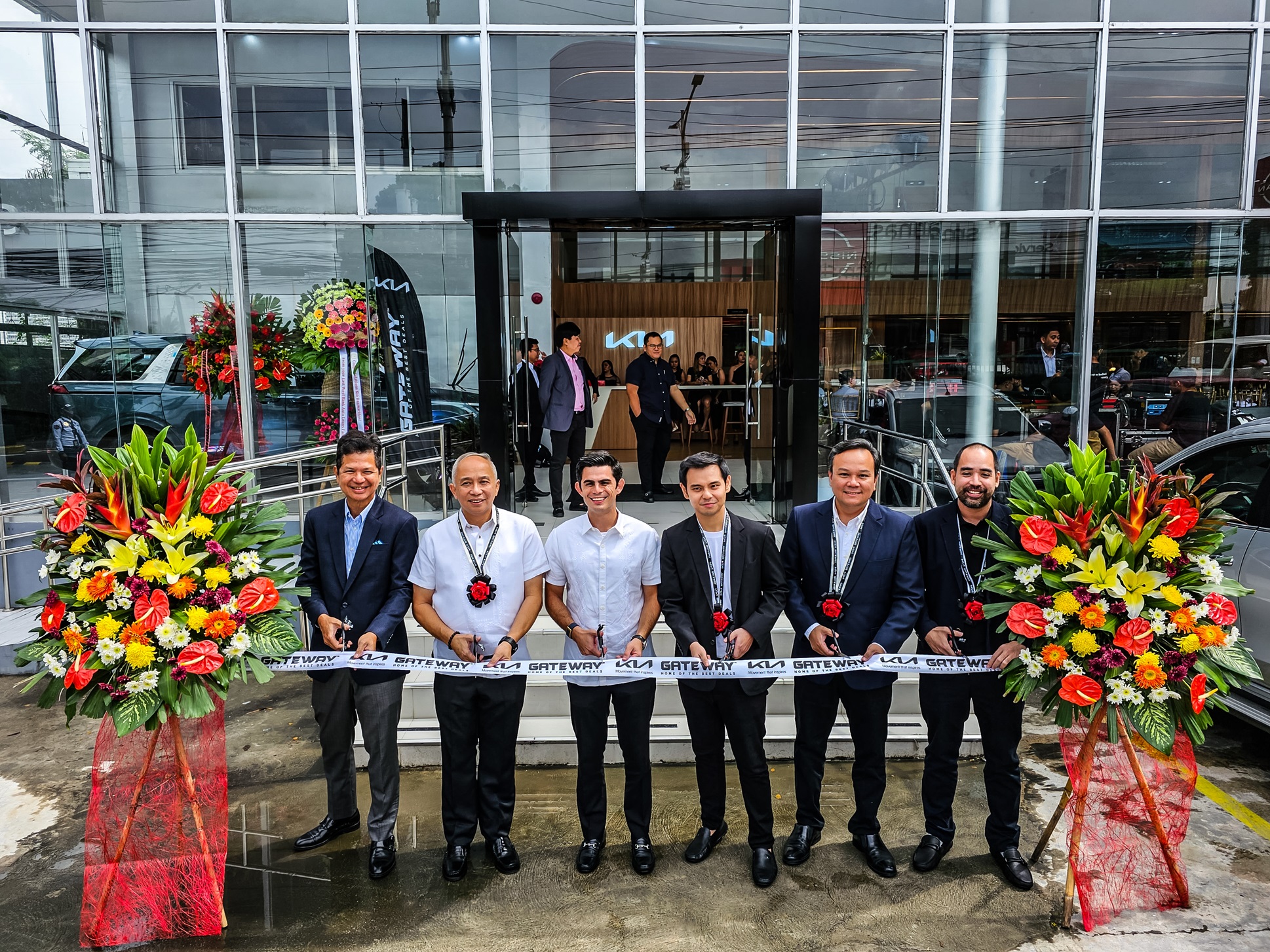 Kia Philippines President Toti Zara, Vice Mayor Raul Rex Mangubat, AC Motors CEO Jaime Alfonso Zobel de Ayala, Gateway Group EVP Michael Goho, Kia Philippines COO Brian Buendia, and Gateway Group President Raymund Basubas officially open the refreshed Kia Dasmariñas dealership.