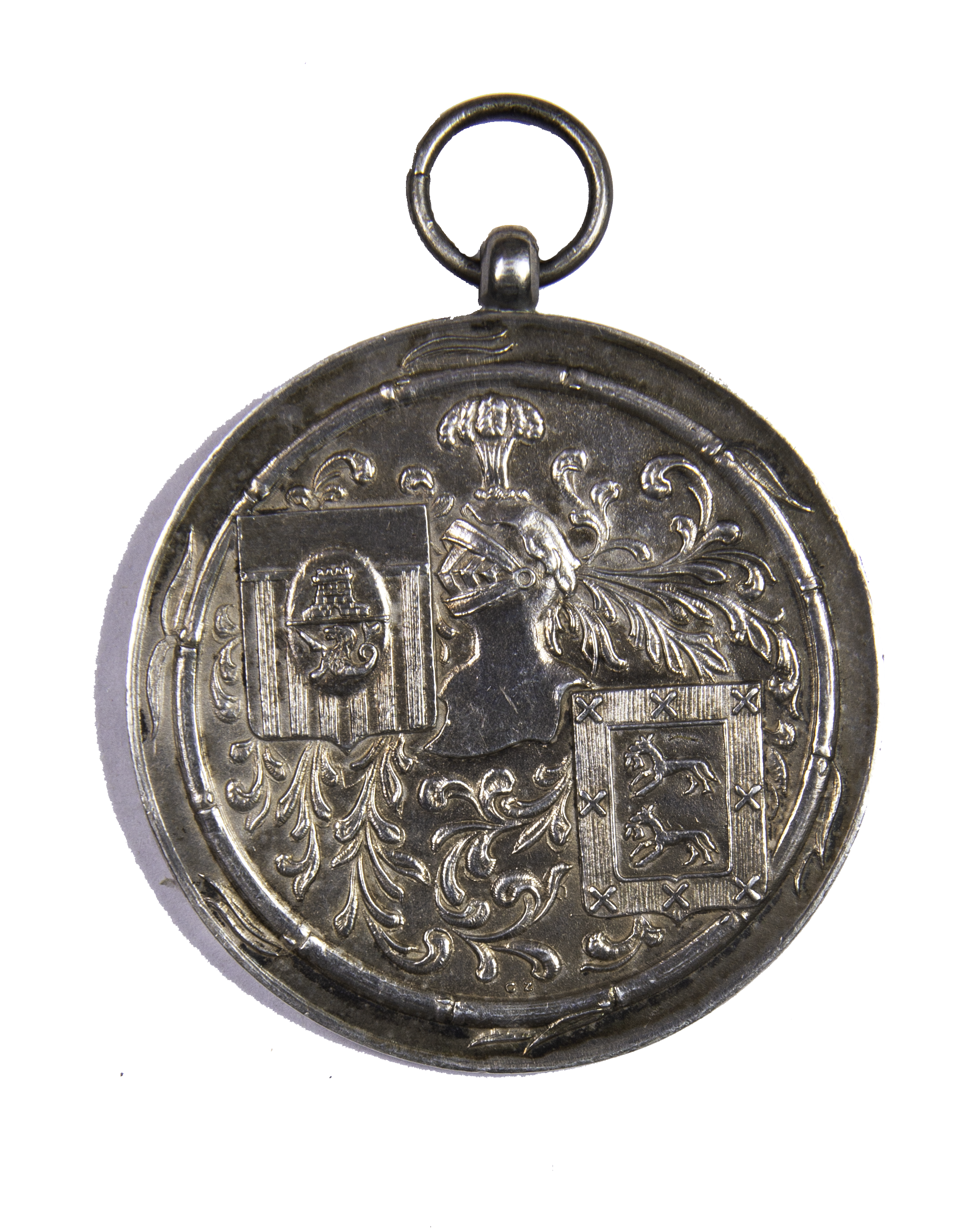 The reverse side of the medallion features elements of the heraldic achievement of the Ayala family and the coat of arms of the Philippines during the American colonial period.