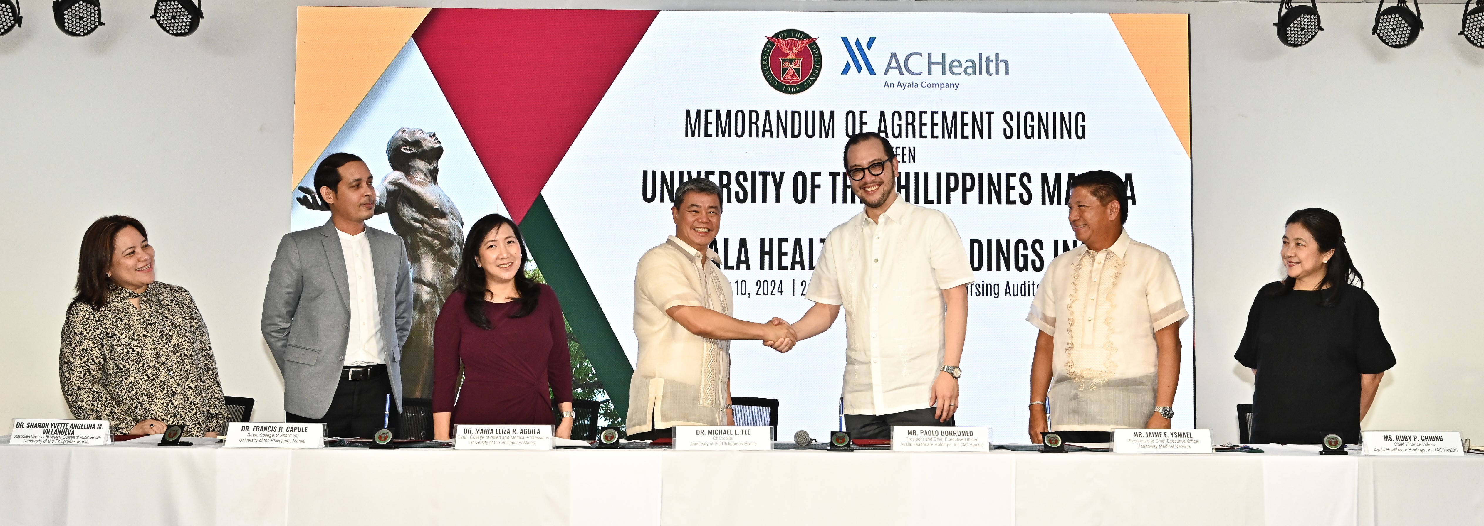 UP Manila Chancellor Dr. Michael L. Tee and AC Health President and CEO Paolo Borromeo shake hands after signing the partnership agreement on May 10, together with (from left) UP Manila College of Public Health Associate Dean for Research Dr. Sharon Yvette Angelina M. Villanueva, College of Pharmacy Dean Dr. Francis R. Capule, College of Allied and Medical Professions Dean Dr. Maria Eliza R. Aguila, Healthway Medical Network President and CEO Jaime E. Ysmael, and AC Health CFO Ruby Chiong