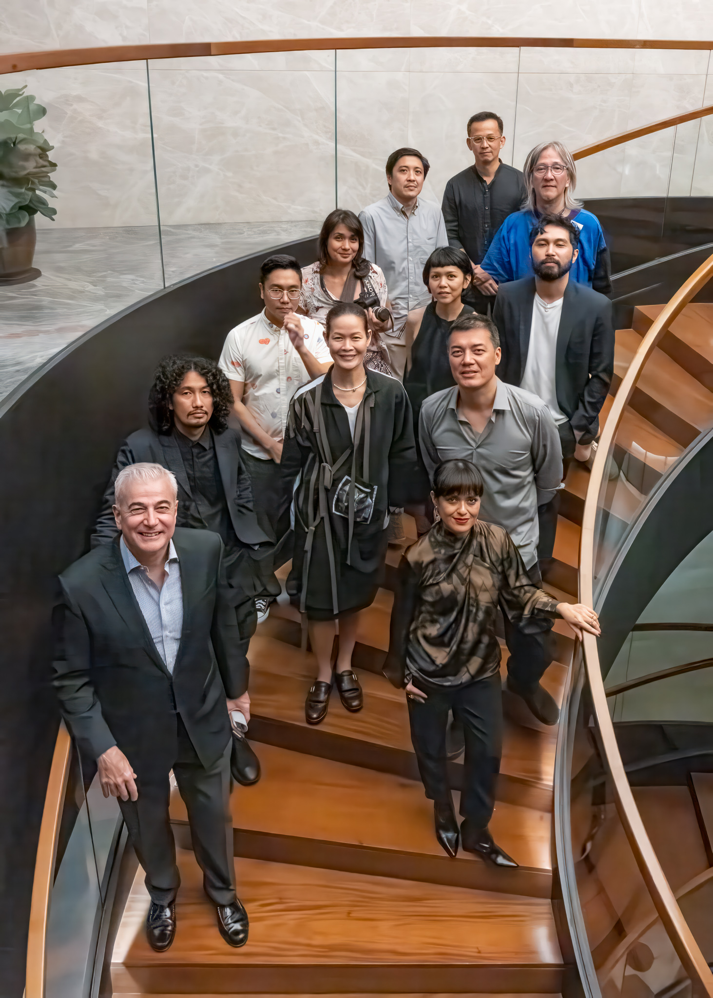 Fernando Zobel de Ayala with some of the Filipino visual artists whose works are displayed in Ayala’s offices.
