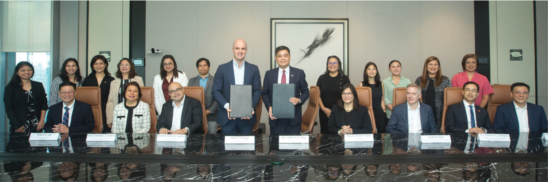 Ayala Corporation Chief Sustainability and Risk Officer Jaime Z. Urquijo and Climate Change Commission Sec. Robert E.A. Borje (standing, center) at the MOU signing on April 12 with (seated, from left) Ayala Land Chief Sustainability Officer Robert Lao, Globe Chief Sustainability and Corporate Communications Officer Yoly Crisanto, CCC Deputy Executive Director Romell Antonio Cuenca, AC Chief Legal Officer Franchette Acosta, ACEN Group CFO and Chief Strategy Officer Jonathan Back, BPI CFO and Chief Sustainability Officer Eric Luchangco, and Ayala Foundation President Tony Lambino, and Ayala group sustainability officers