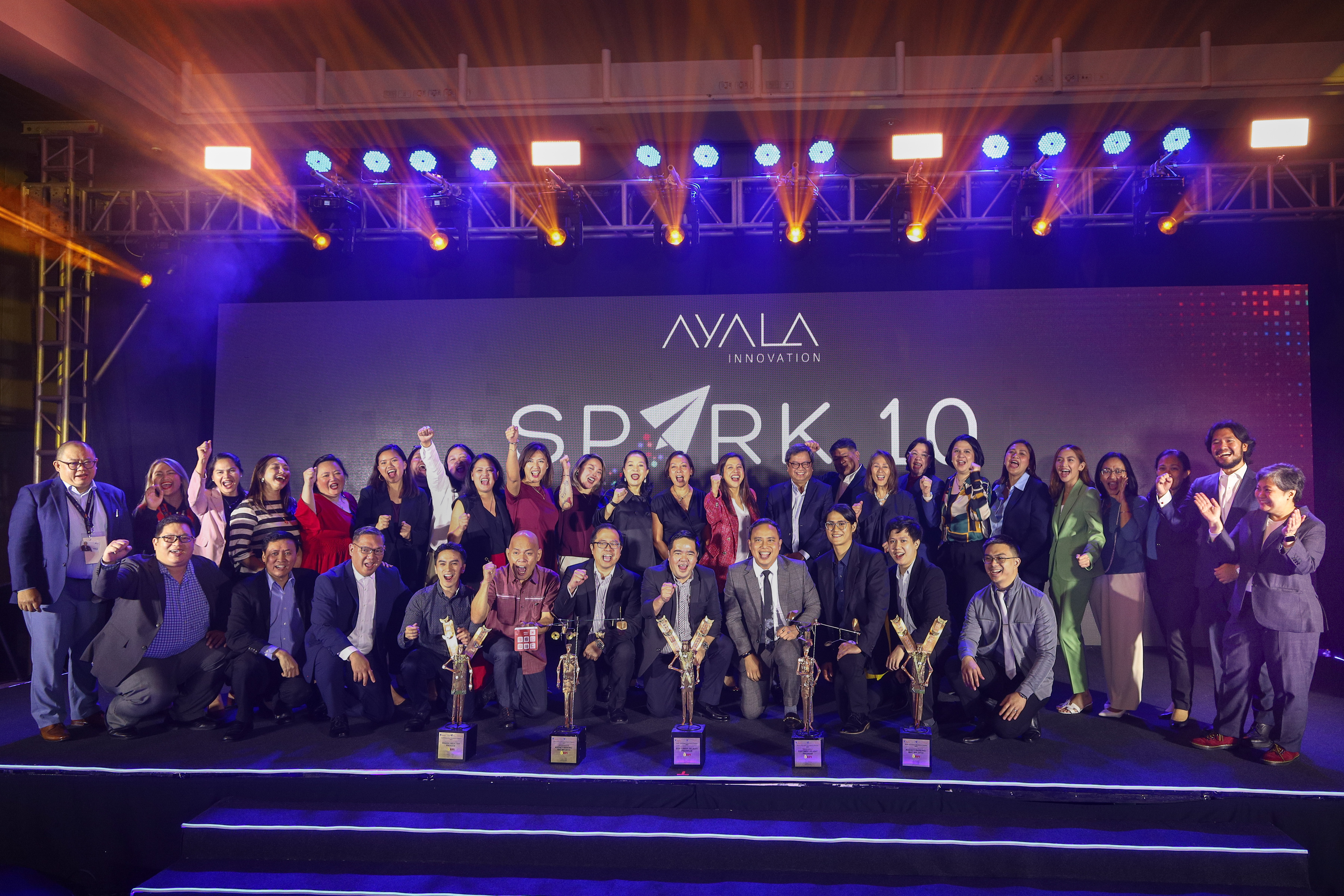 BPI’s Hidden Wealthy Program, Agency Banking, and Customer Delight Program teams celebrate the bank’s unprecedented victory at the 8th Ayala Innovation Excellence Awards held during Spark*10: The Ayala Group Innovation Summit on November 21.